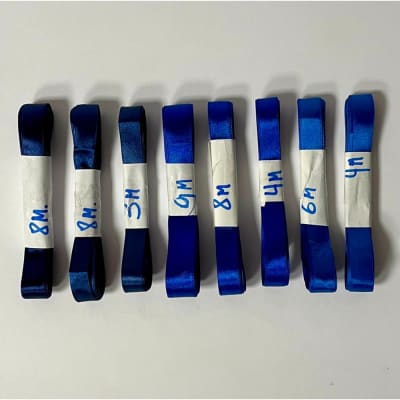 Cintas satín de 15 y 20 mm en tonos azules, 50 metros total - Producto de vitrina1