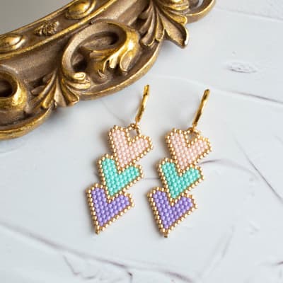 Aros Tres corazones lila, turquesa y durazno1