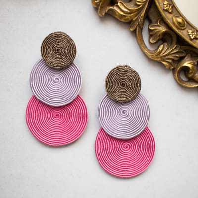 Aros Tres círculos bronce, lila y rosado1