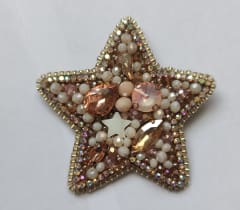 Prendedor estrella dorada