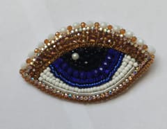 Prendedor ojo azul