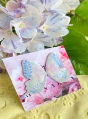 Aros Mariposa línea botánica en color gris, verde, rosa y azul