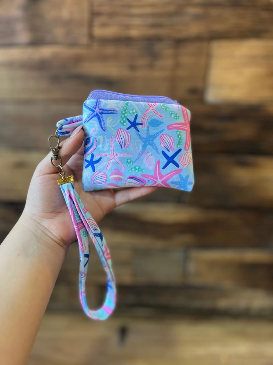 Monedero acolchado con cierre y asa  variedad de diseños y colores6