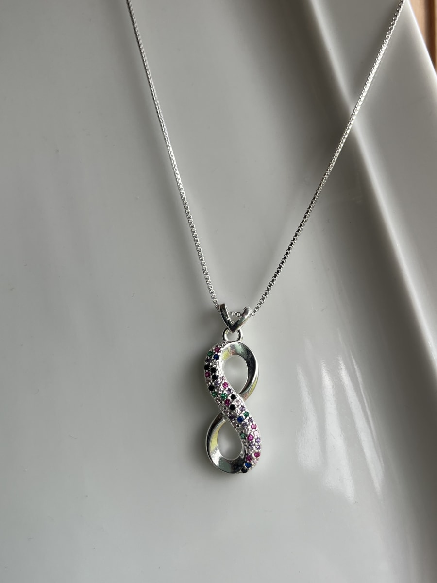 Collar plata 925 infinito raiz de rubi esmeralda y onix1