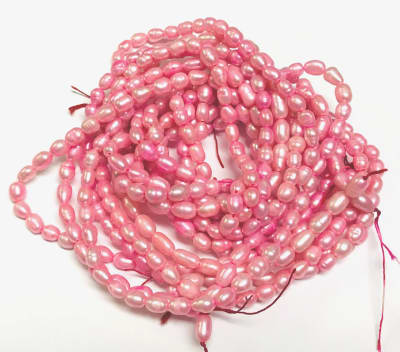 Perla Natural Arroz Fucsia 7x5mm (Tira)
