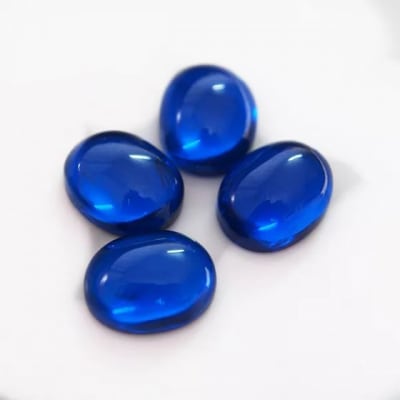 12x10mm Zafiro Azúl Espinel Sintético Coubuchón Oval (Un)