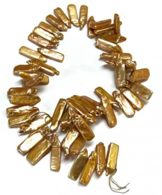 Perla Natural Dientes Oro 16x7.5mm (Tira)1