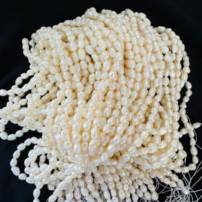 Perla Natural Arroz Crema Lisa 10x9mm (Tira)