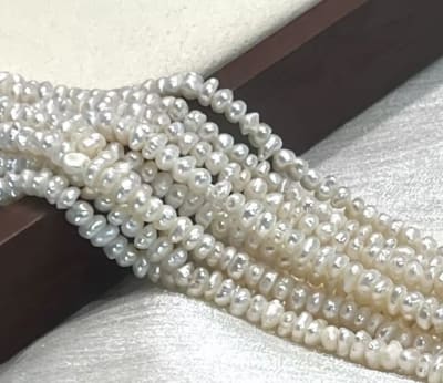 Perla Natural Rústica Botón 3-4mm Crema (Tira)1