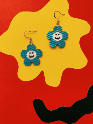 Aros flores smile blanco celeste