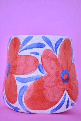 Maceta (flores rojas)