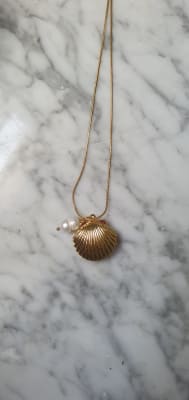 CADENA DE ACERO MAS CONCHA DE LATON PERLA DE RIO1