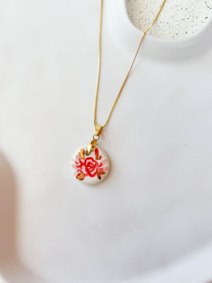 collar medalla flor