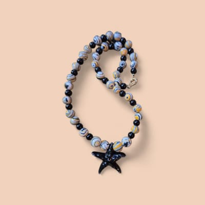 Collar amarillo estrella negra