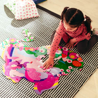 Puzzle de cartón 50 piezas Unicornio y niña