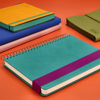 CUADERNO PU 15X21  TURQUESA ELASTICO MORADO