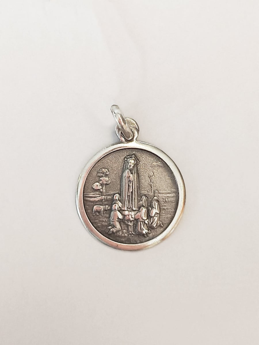 HECHURA MEDALLA PLATA V NIÑA 18MM1