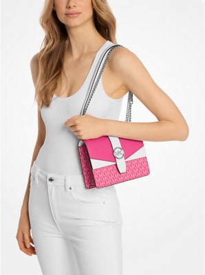 Cartera Michael Kors Crossbody Greenwich pequeña fucsia con blanco