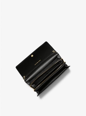 Cartera Michael Kors Jet set item rectangular negro Strap letras blancas