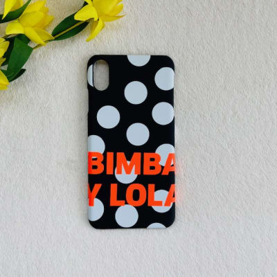 Carcasa Bimba y Lola puntos blancos letras naranjo negra
