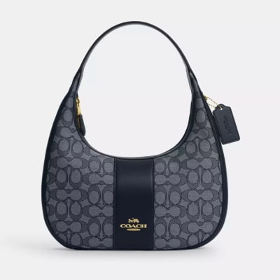 Cartera Coach Carmen tipo bote azul marino monograma1