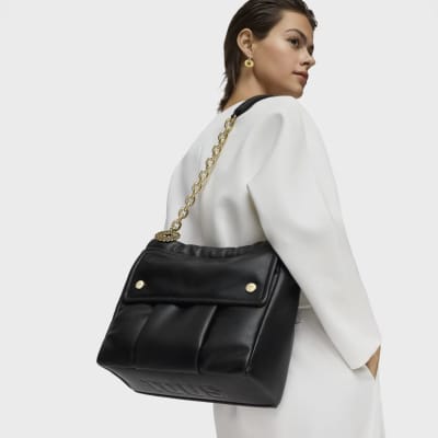 Cartera Tous Grande con colgante de flor plata Negro1