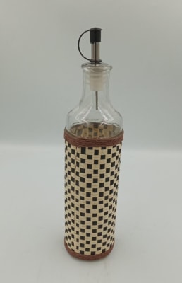 BOTELLA REDONDA DE ALCUZA TEJIDA BEIJE/NEGRO1