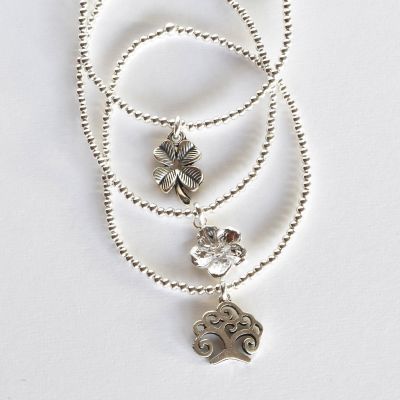 PULSERA ELASTICADA FLOR, ÁRBOL DE LA VIDA O TRÉBOL1