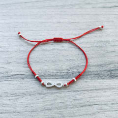 PULSERA HILO ROJO NUDOS CENTRO INFINITO CON CIRCONES