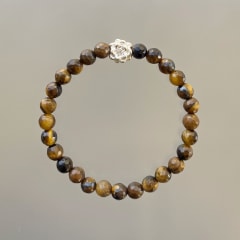 PULSERA OJO DE TIGRE FACETADA Y  FLOR DE LOTO