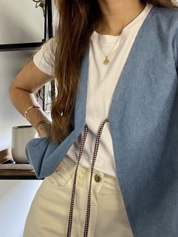 Chaleco Lyon celeste/vino