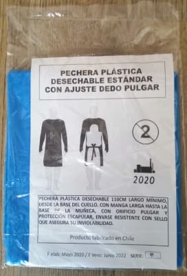 Caja de 200 unidades Pechera Desechable Azulina con Ojal 25 micra 1