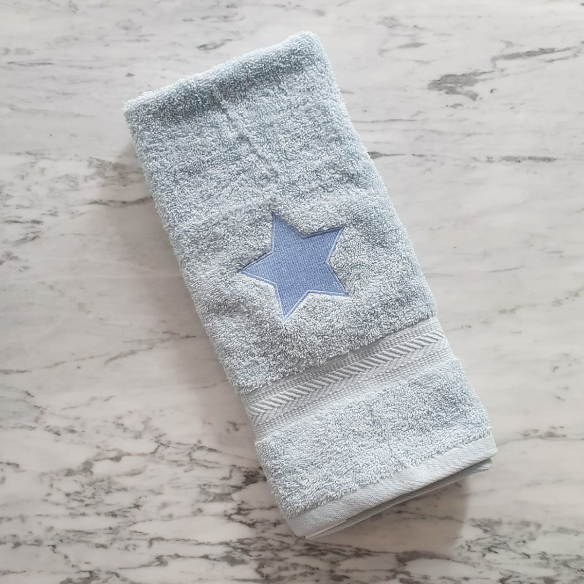 Toalla estrella Celeste1