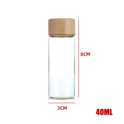 BOTELLA DE VIDRIO CON TAPA DE BAMBÚ 3X8CM1