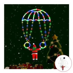 Viejo pascuero en paracaídas de luces multicolor
