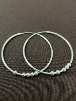 Aros modelo argolla con pelotitas 1