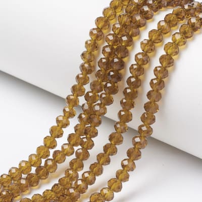 CRISTAL AUSTRIACO POR TIRA 4X3MM VARA DE ORO OSCURO1
