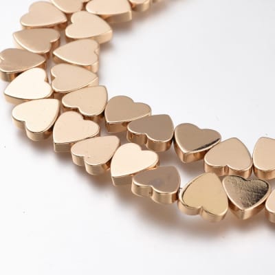 HEMATITA CON BAÑO CORAZON LIGHT GOLD 8MM1