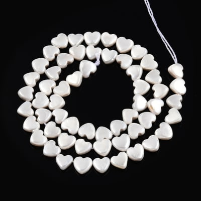 PERLAS POR TIRA CORAZON 6X4MM1