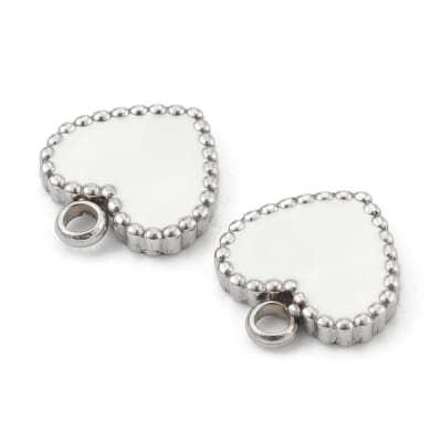 COLGANTE ACERO INOX. CORAZON PLATEADO ESMALTE BLANCO 11X10MM1