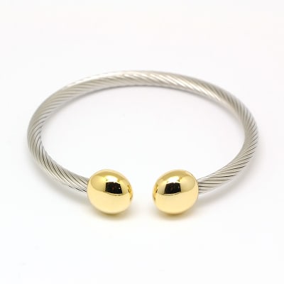 BRAZALETE ACERO INOX. TORNEADO TERM. DORADO