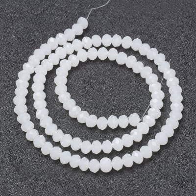 CRISTAL AUSTRIACO POR TIRA BLANCO 2.3~2.7x1.5MM APROX. 140PCS.1