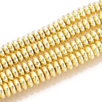 HEMATITA CON BAÑO DORADA TIRA ARANDELA 6X3MM  APROX. 133PCS.1