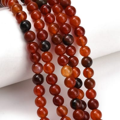 CORNALINA NATURAL REDONDO LISO GRADO B 6MM APROX. 62PCS.