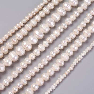 PERLAS DE RIO POR TIRA SURTIDAS 3~13x3~13MM