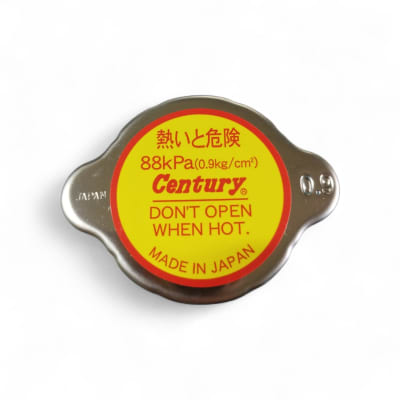 TAPA DE RADIADOR METALICA (0.9) KG/CM2 CENTURY JAPON  DIAMENTRO GOMA INT 28.5MM ALTURA TOTAL 20.5MM