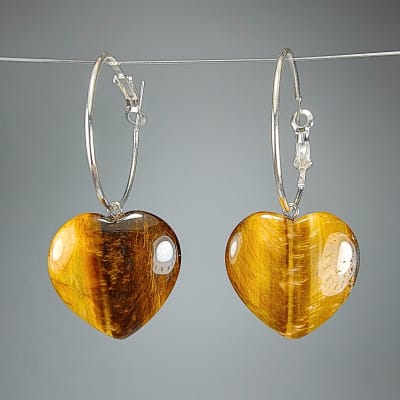 Argollas Con Dijes De Ojo De Tigre Y Fantasía Plateada en Corazones Pulidos de 25 mm