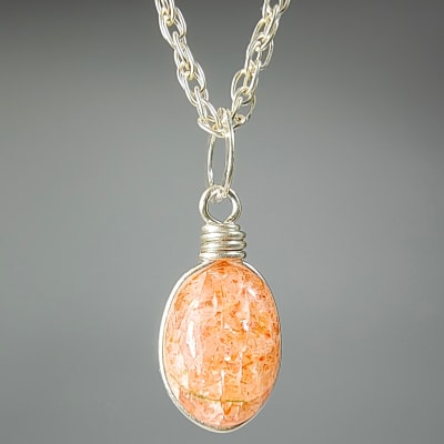 Colgante De Piedra Sol en Cabuchón Oval de 10 mm1