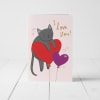 Tarjeta de San Valentin con diseño de gatito sobre globos 