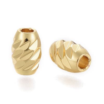 Separador forma de arroz textura 7x5 mm baño oro / unidad